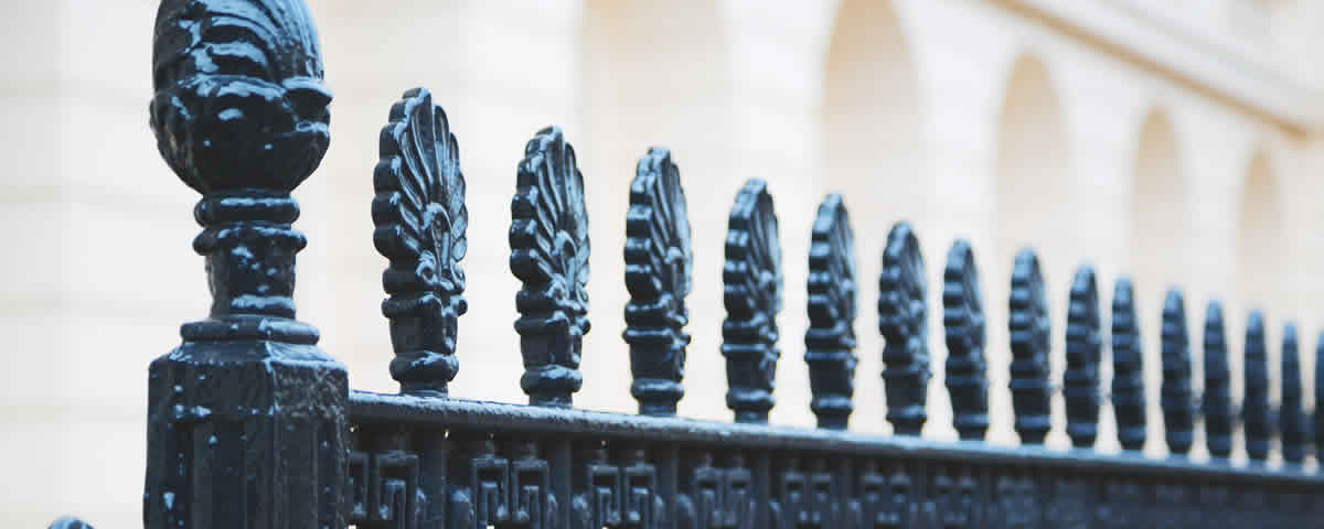 Caste iron fence with ornamental finials